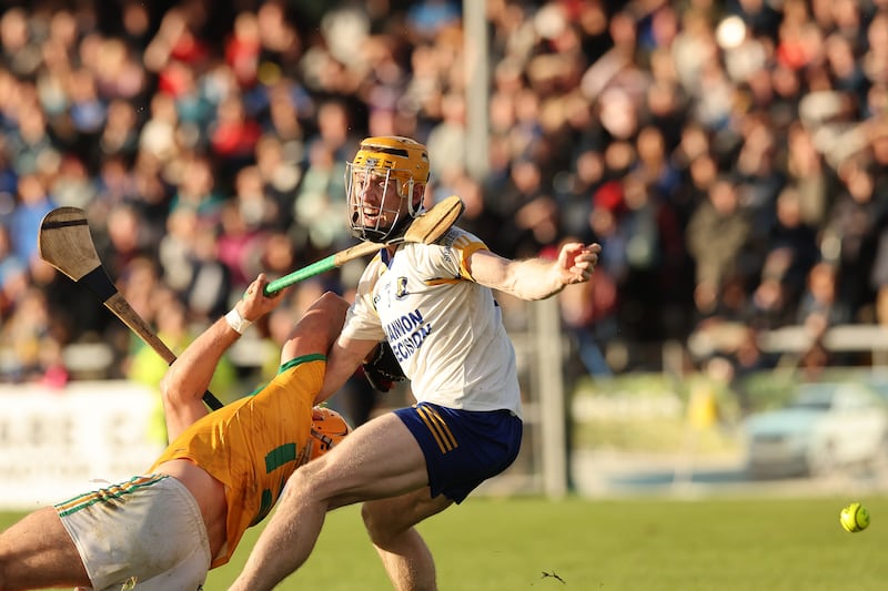 Barry Fitzpatrick of Sixmilebridge in action against Martin Daly of Feakle. Photograph: Natasha Barton/Inpho