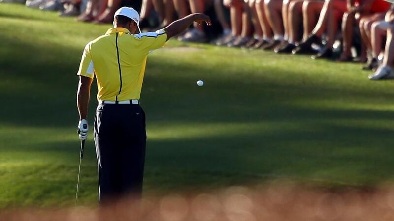 Tiger Woods of the United States drops his ball after he hit it into the water on the 15th hole during the second round of the 2013 Masters at Augusta National. Photograph: Mike Ehrmann/Getty Images