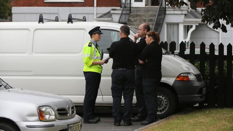 Gardai at the scene of the murder in Sandfield Mews, Ennis this morning. Photograph: Eamon Ward