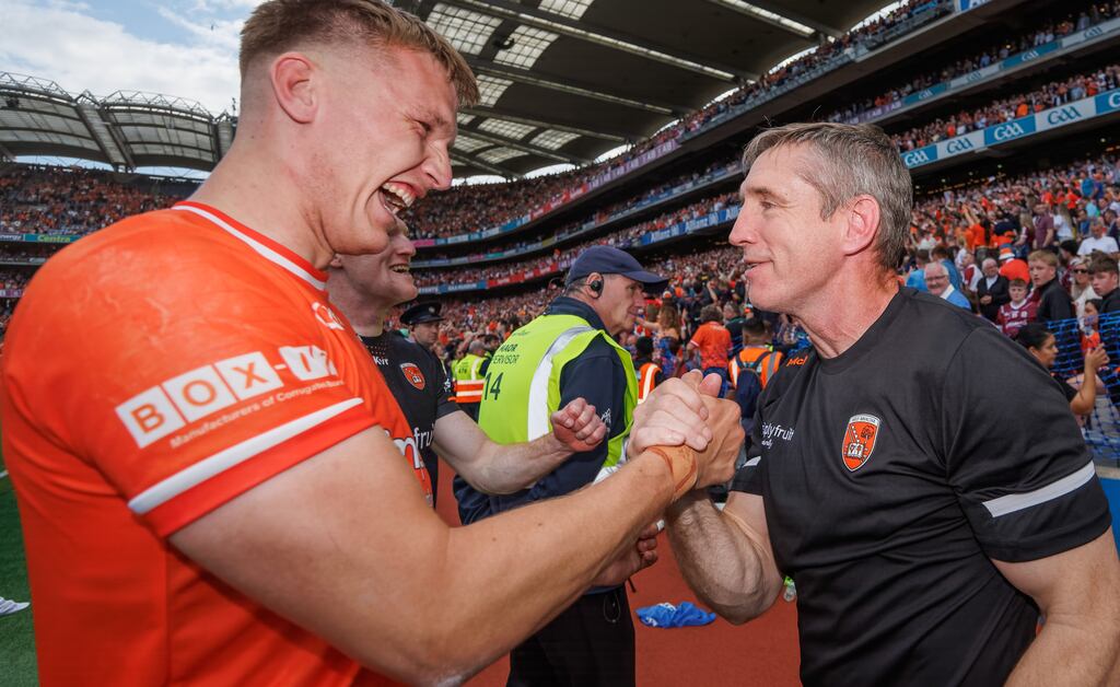 Armagh’s Rian O'Neill and manager Kieran McGeeney celebrate a famous victory Photograph: James Crombie/Inpho