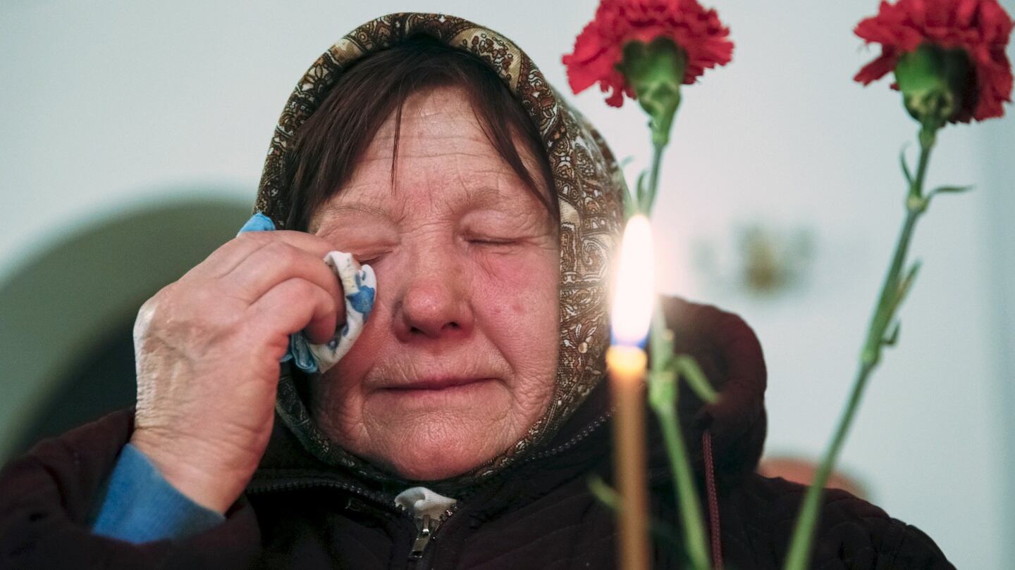 A woman cries during a memorial service for victims of the Chernobyl nuclear disaster in a church in Kiev, Ukraine, on Tuesday. Photograph: Valentyn Ogirenko/Reuters