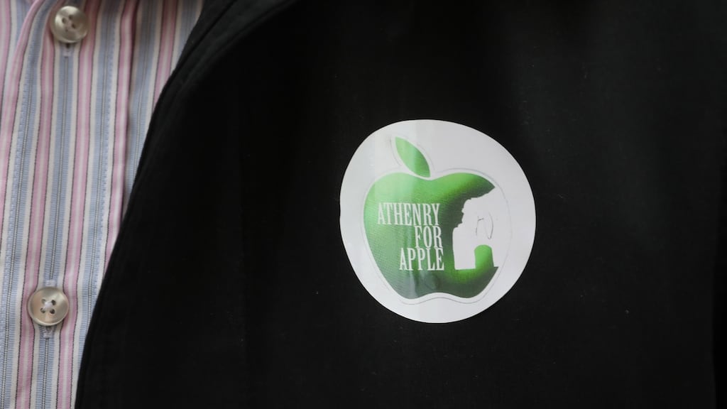‘Athenry for Apple’ badge on supporter outside the Four Courts. Photograph: Collins Courts