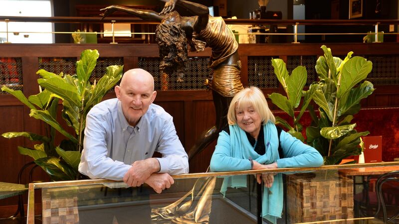 Paddy and Veronica Campbell and one of several sculptures by him dotted throughout upstairs. Photograph: Dara Mac Dónaill/The Irish Times
