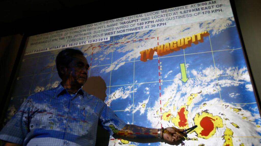 Alexander Pama, head of the national disaster agency, shows the digital path of Typhoon Hagupit following a press briefing inside the military headquarters east of Manila, Philippines. Philippine authorities have begun to evacuate coastal areas that could be hit by the storm. Photograph: Denis Sabangan/EPA