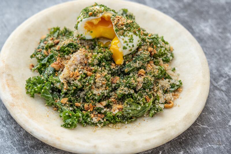 Quinoa and kale salad with poached mackerel, tahini dressing and a soft boiled egg. Photograph: Harry Weir Photography