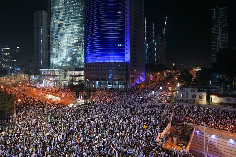 A recent protest in Tel Aviv against the ruling coalition. Government plans include bills that would allow politicians to appoint all supreme court judges, and an override clause that would mean a simple parliamentary majority could quash the court’s rulings. Photograph: Tsafrir Abayov/AP