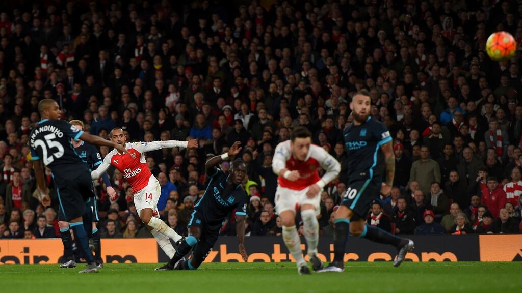 Theo Walcott scores Arsenal’s opening goal during the Premier League match against Manchester City at the Emirates Stadium. Photograph: Michael Regan/Getty