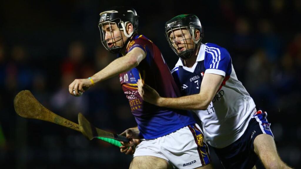 WIT’s Ger Teehan tackles John McGrath of UL. Photograph: Cathal Noonan/Inpho