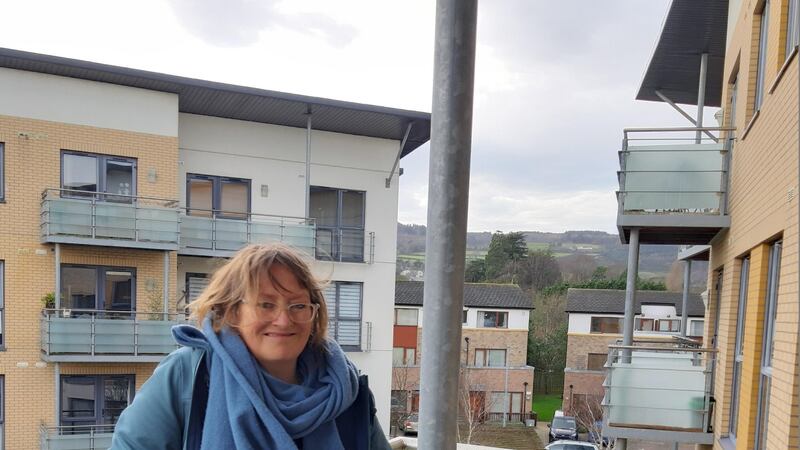 Nell Regan on her apartment balcony