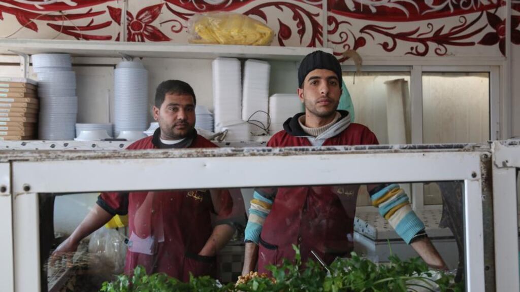 Mohammad and a colleague in the falafel restaurant where they work in Zaatari refugee camp. Photograph: Sally Hayden