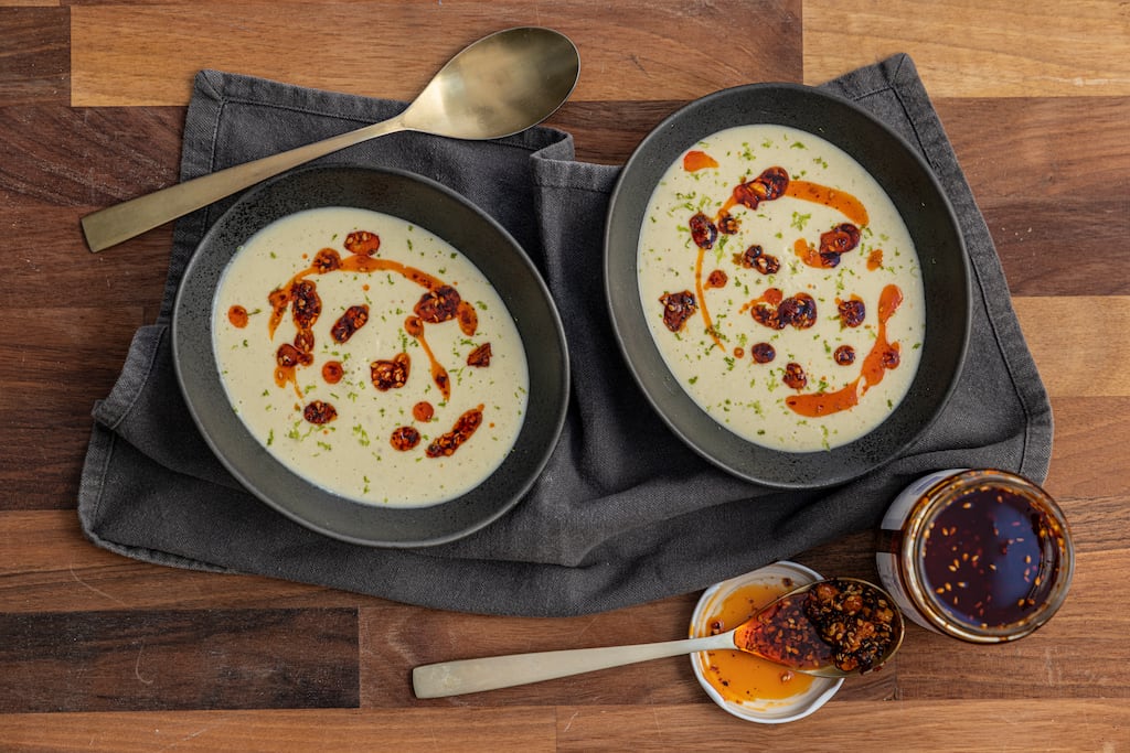 Spiced coconut and cauliflower soup with peanut and chilli rayu. Photograph: Harry Weir
