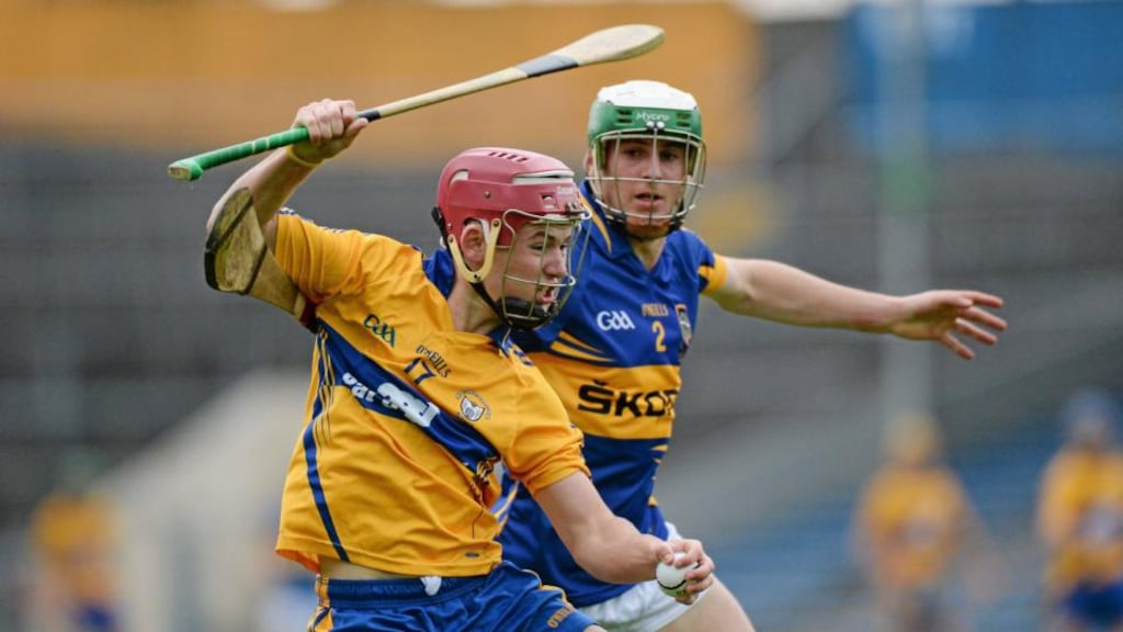 Davy O’Halloran of Clare holds off Tipperary’s Cathal Barrett during the Munster Under-21 championship final at Semple Stadium. Photograph: Matt Browne/ Sportsfile