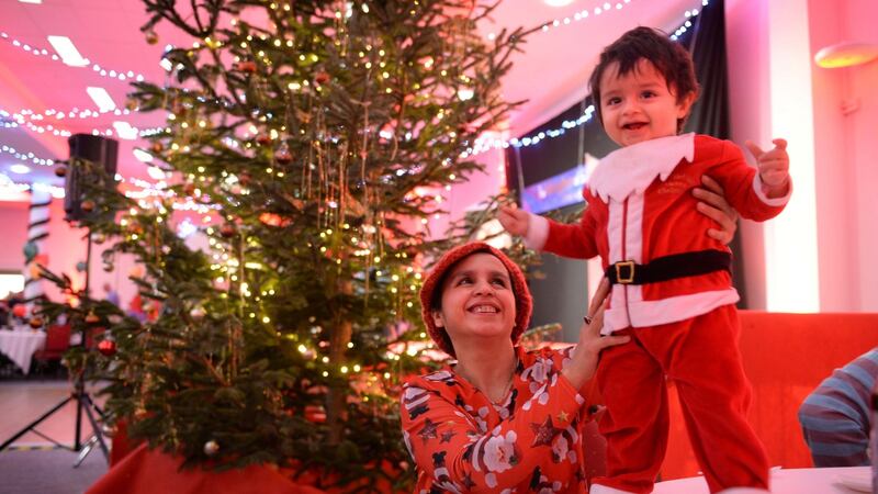 Shazia Butt and her son Muhammad Gabrielle (2) at the Knights of Columbanus Christmas dinner at the RDS, Dublin. Photograph: Dara Mac Dónaill