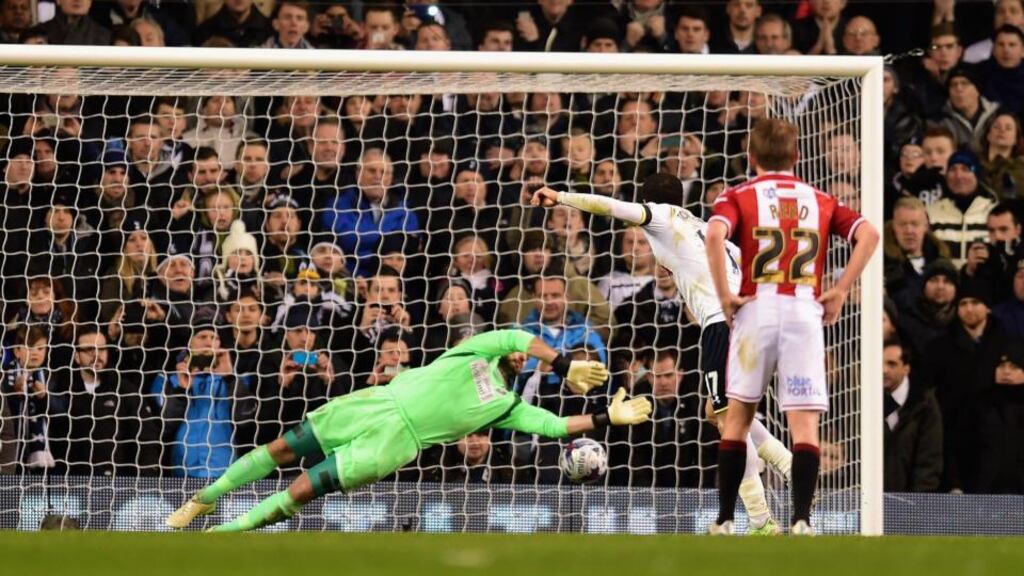 Tottenham’s Andros Townsend fires a penalty kick past Sheffield United goalkeeper Mark Howard during the first leg of the Capital One Cup semi-final at White Hart Lane. Photograph:  Jamie McDonald/Getty Images