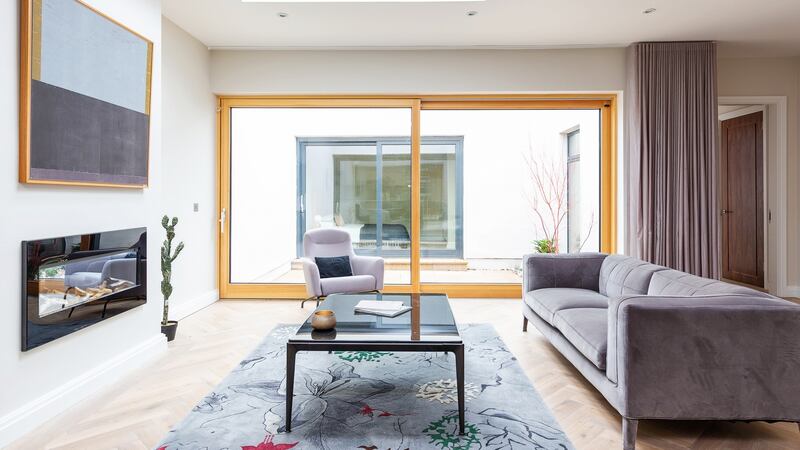 Light pools into every corner thanks to engineered triple-glazed windows, roof lights and large-format sliding doors