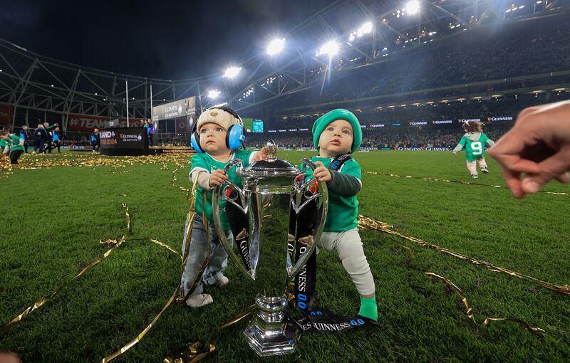 Nico and Jai, sons of James Lowe and Jamison Gibson-Park, with the Guinness Six Nations trophy after Ireland's win over Scotland. Photograph: Dan Sheridan/Inpho