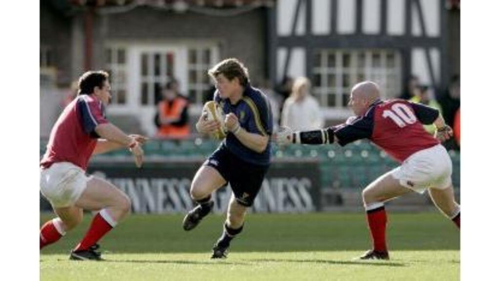 Brian O'Driscoll, seen here bursting between Munster's David Wallace and Paul Burke in May's Celtic Cup semi-final, returns to captain Leinster this afternoon as the provinces meet in the Celtic League at the RDS.