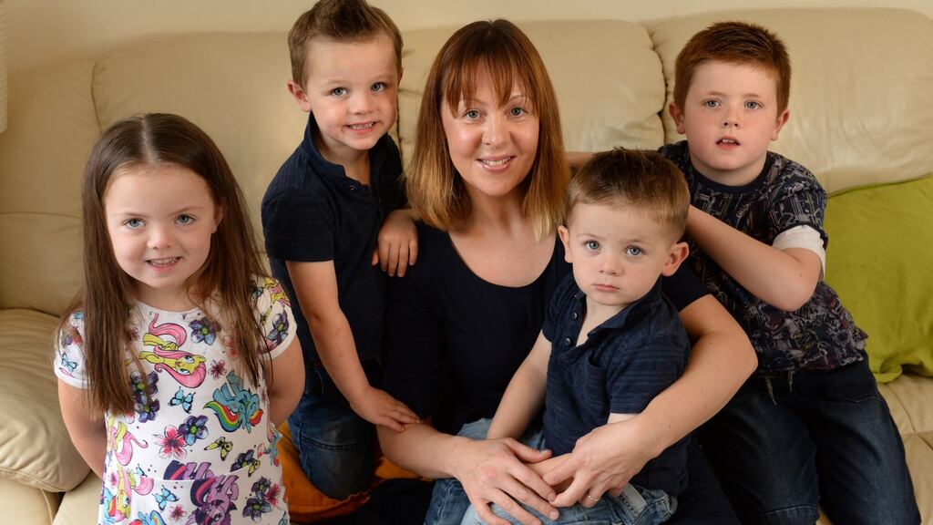 Paula Finnegan  with her children, from left: Millien (5), Luke (3), Tom (2) and Sam (7) at home in Cabra, Dublin. Photograph: Dara Mac Dónaill