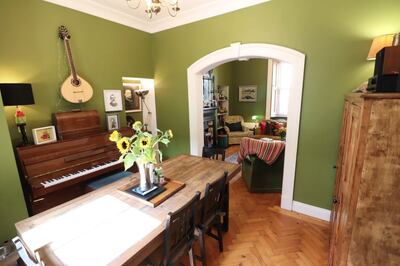 2 Saint Joseph’s Terrace: living and diningrooms open on to each other through a ceiling arch, with wooden herringbone floors underfoot.