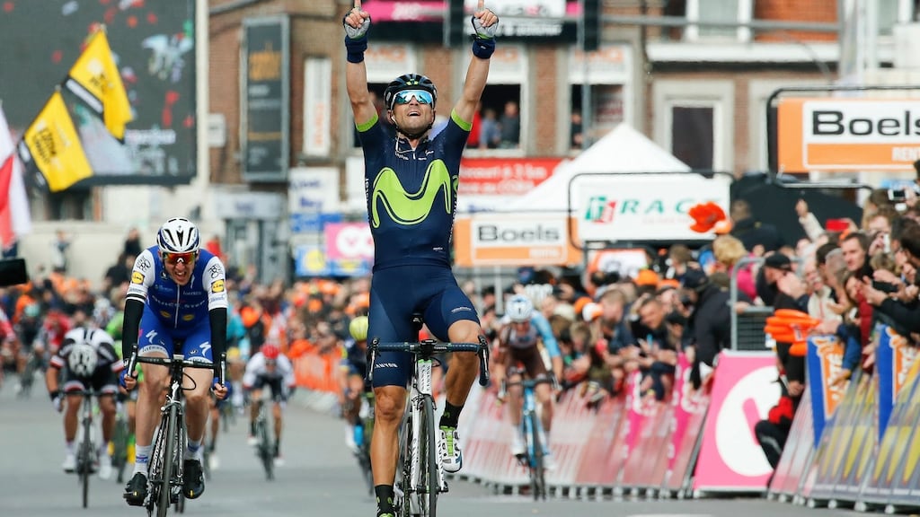 Spanish rider Alejandro Valverde celebrates while crossing the finish line to win the Liège-Bastogne-Liège ahead of Ireland’s Dan Martin (left). Photograph: Julien Warnand/EPA