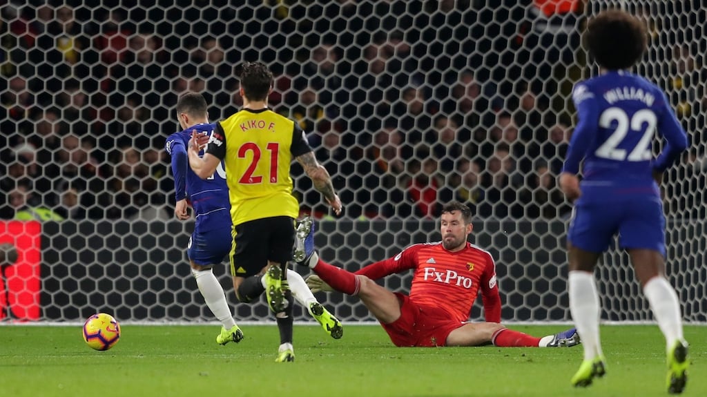 Eden Hazard scores the opener for Chelsea at Vicarage Road. Photograph: Richard Heathcote/Getty Images