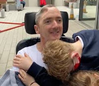 Des Vallely getting hugs from his children Daniel (12) and Ella Rose (9) in the NRH for the first time in six months.