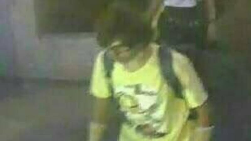 A man wearing a yellow T-shirt and carrying a backpack is seen walking near the Erawan shrine, where a bomb blast killed 22 people on Monday in Bangkok. Photograph: Thai police handout via Reuters