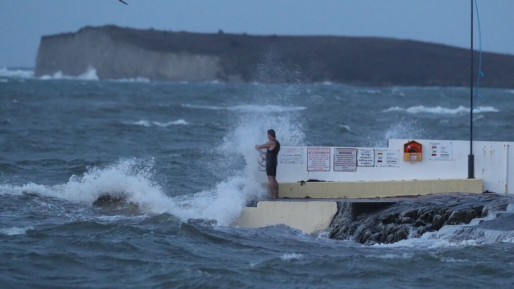 A man stands on Blackrock swimming tower in Salthill, Co Galway during Storm Callum. File photograph: Brian Lawless/PA Wire