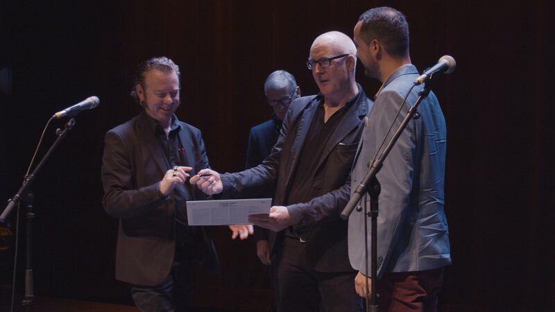 Eamonn Dowd signs his new lp onstage in the Cité du Vin, with Eamon Carr, John Fleming and Benjamin Menouret: “The most wretched ever seen”. Photograph: Killian Ginnity