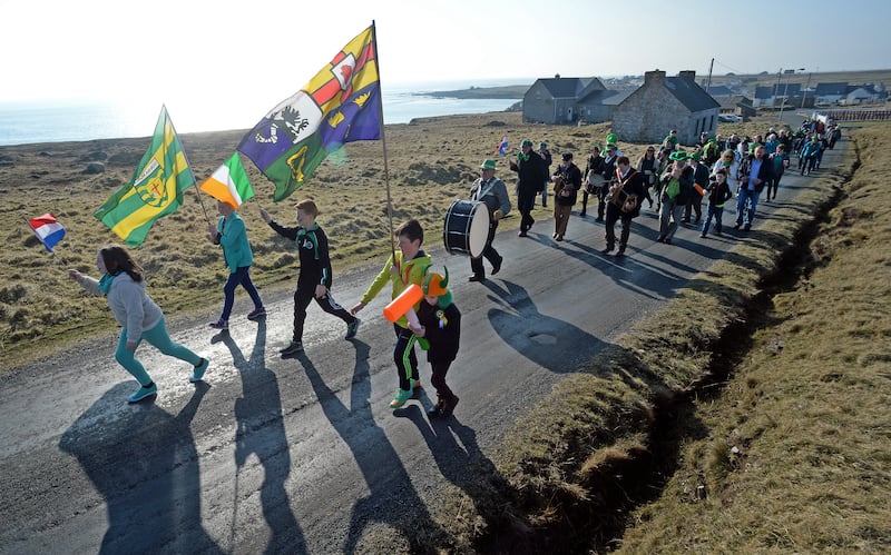 Local children lead the parade of islanders on St Patrick's Day on Tory island. Photograph: Eric Luke