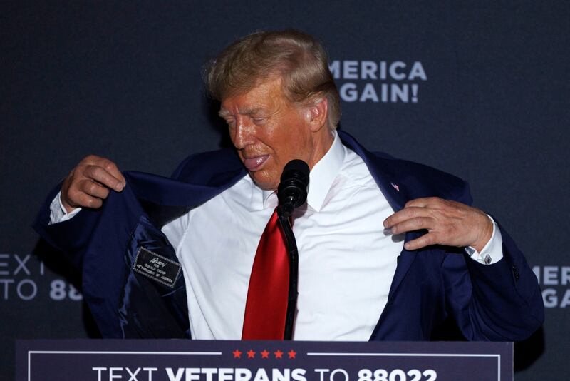Donald Trump gestures in reference to the heat during his address to supporters in New Hampshire. Photograph: Cj Gunther/EPA-EFE