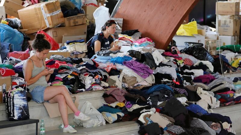 Donated clothes ready to be distributed in a gym in Amatrice, Italy, after an earthquake there. Photograph: Ciro De Luca/Reuters
