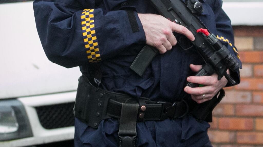 A Garda during a raid in Sallins Bridge, Co Kildare. Photograph: Gareth Chaney/Collins