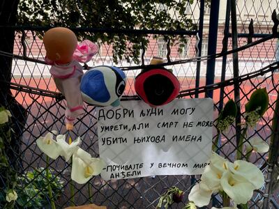 Flowers outside the school in Belgrade where a 13-year-old boy killed nine classmates and a security guard