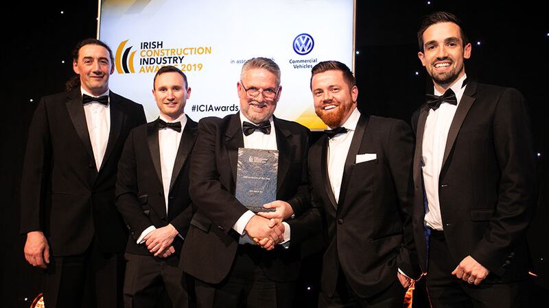 Patrick Devlin, General Manager, Zutec presents the BIM Initiative of the Year award to the John Sisk & Son team.