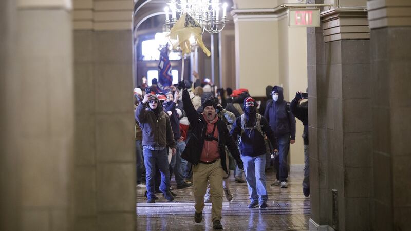 Demonstrators breaches barricades to enter the U.S. Capitol during a protest at the Ellipse in Washington. Photograph: Ting Shen/Bloomberg