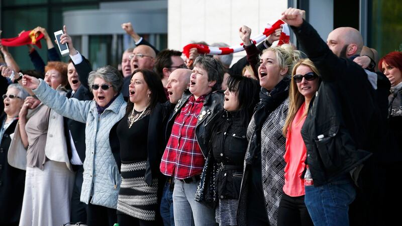 Relatives sing ‘You’ll never walk alone’ after the jury delivered its verdict at the new inquests into the Hillsborough disaster, in Warrington. Photograph: Andrew Yates/Reuters
