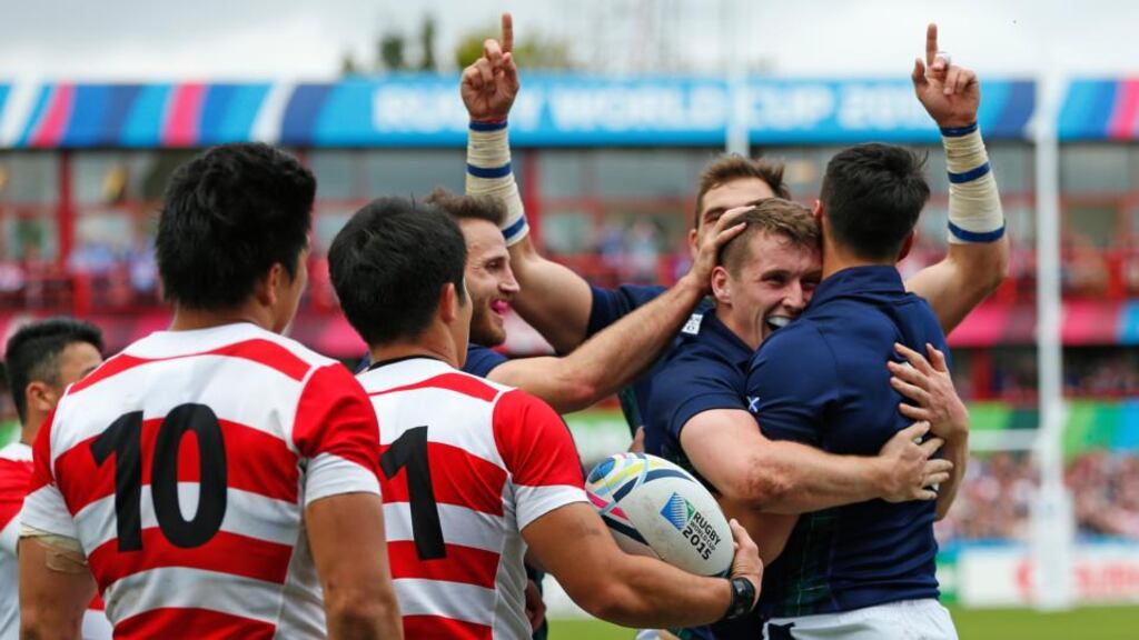 Mark Bennett celebrates after scoring his second try during Scotland’s 45-10 win over Japan at Kingsholm. Photograph: Reuters