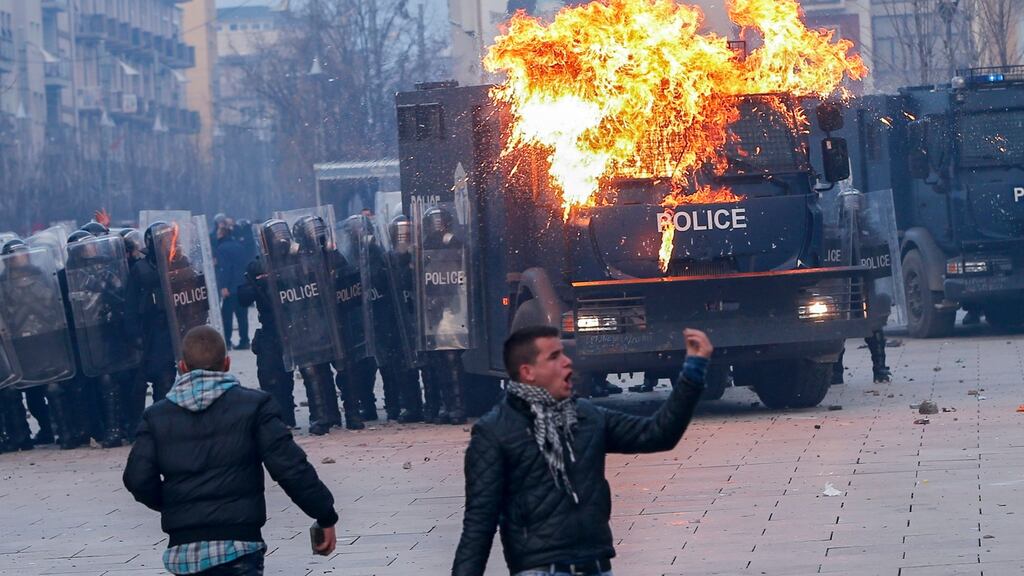 Protesters throw molotov cocktails during a violent protest in Pristina, Kosovo, on Saturday. Photograph: EPA/Valdrin Xhemaj
