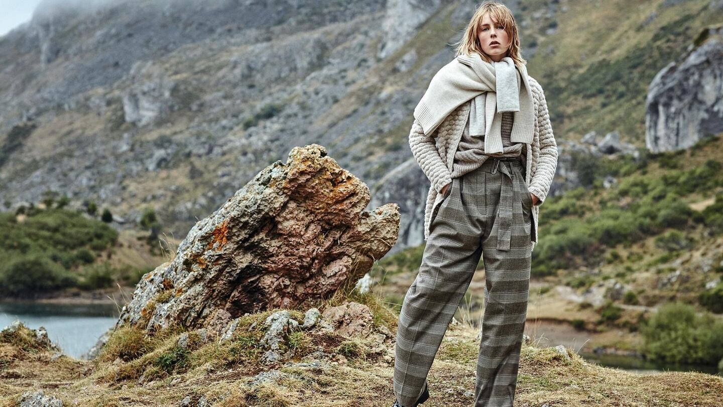 Heavy textured knits from Mango in a jumper €39.99, cardigan €49.99, with check trousers €49.99, boots €59.99.