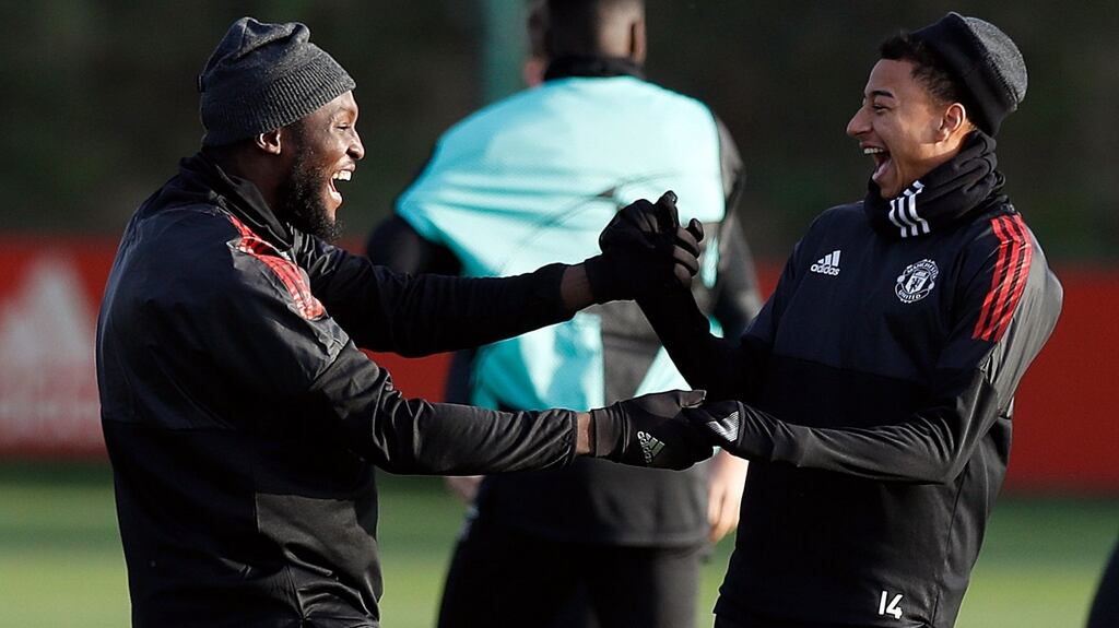 Romelu Lukaku and Jesse Lingard train ahead of Manchester United’s Champions League clash with Benfica. Photograph: Martin Rickett/PA
