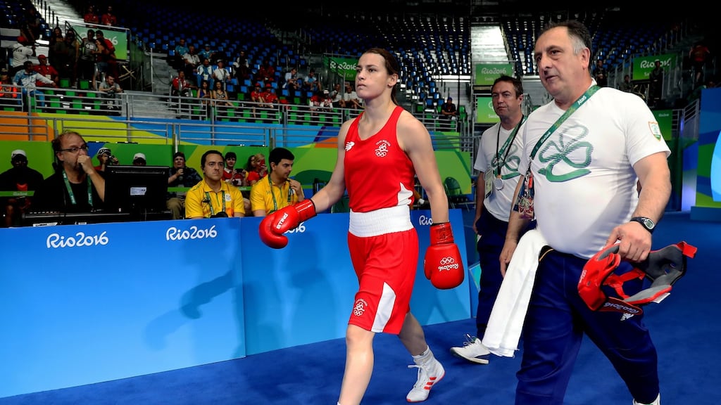 Katie Taylor makes her way to the ring with coach Zaur Antia: “Nobody can convince me that Katie lost this fight.” Photograph: Dan Sheridan/Inpho