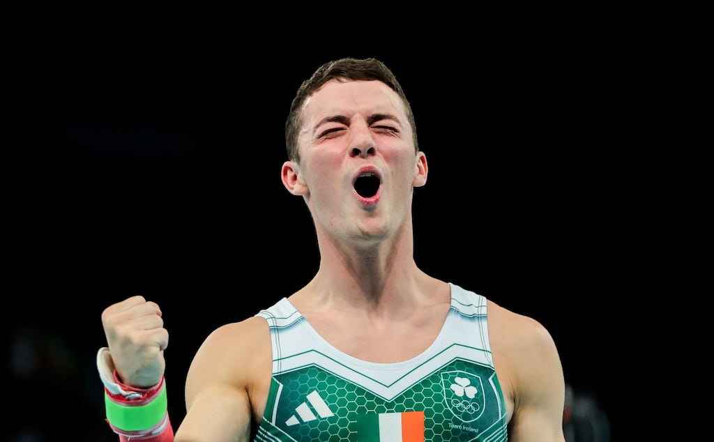 Ireland’s Rhys McClenaghan celebrates after winning gold in the men's pommel horse at the Olympic Games. Photograph: James Crombie/Inpho