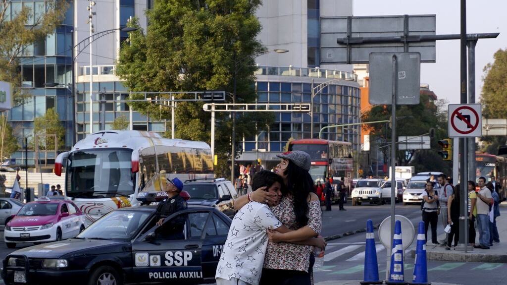 A woman embraces a boy as a powerful earthquake rocks Mexico City on February 16th, 2018. Photograph: AFP/Getty Images