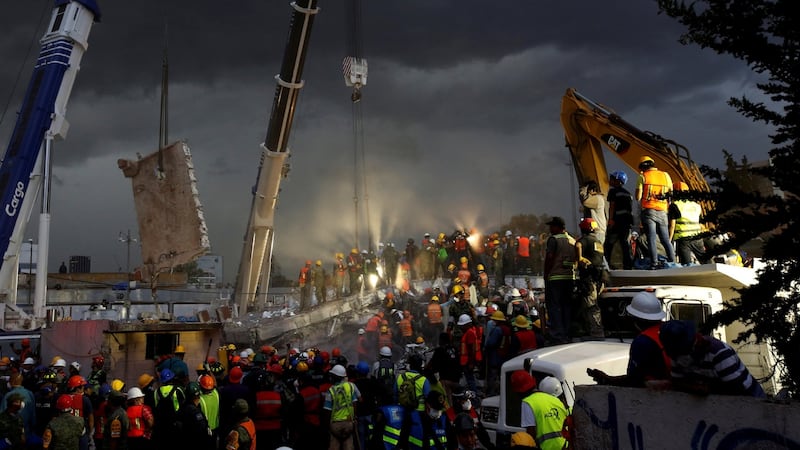 Rescue workers and Mexican soldiers take part in a rescue operation at a collapsed building after an earthquake at the Obrera neighborhood in Mexico City. Photograph: Photograph: Reuters/Carlos Jasso