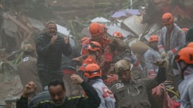 Girl rescued after 16 hours under mud as heavy rain leaves seven dead in Brazil