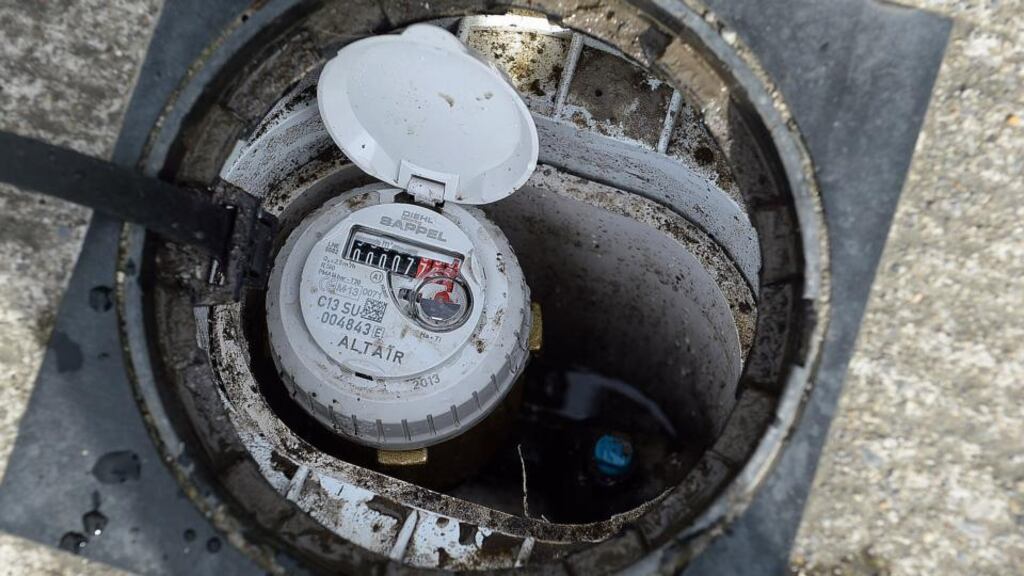 A water meter in place outside a residence. The water charge is expected to cost some €240 per house each year. A Labour demand for the abolition or reduction of a potential €50 annual standing charge per household has complicated the discussions. Photograph: Cyril Byrne/The Irish Times