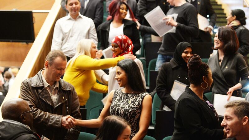 Candidates celebrate becoming Irish citizens at the Convention Centre in Dublin. Photograph: Alan Betson/The Irish Times