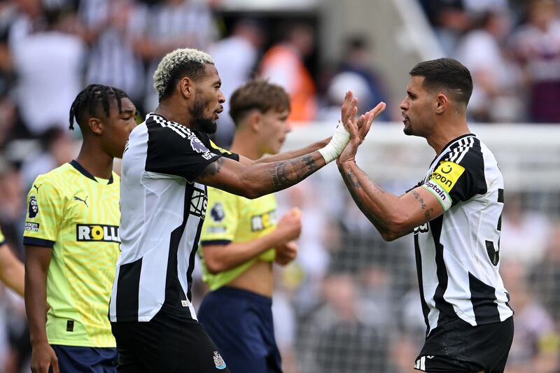 Bruno Guimaraes and Joelinton of Newcastle United celebrate the team's victory. Photograph: Stu Forster/Getty