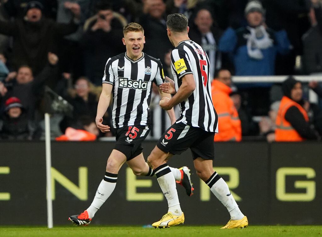 Newcastle United's Harvey Barnes celebrates with Fabian Schar. Photograph: Owen Humphreys/PA Wire